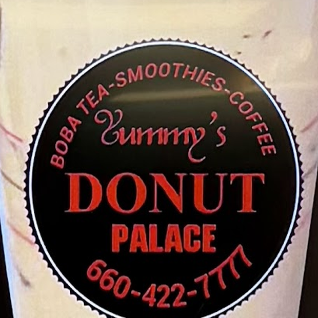 The round Yummy's Donut Palace badge: boba tea, smoothies and coffee around the shop name.